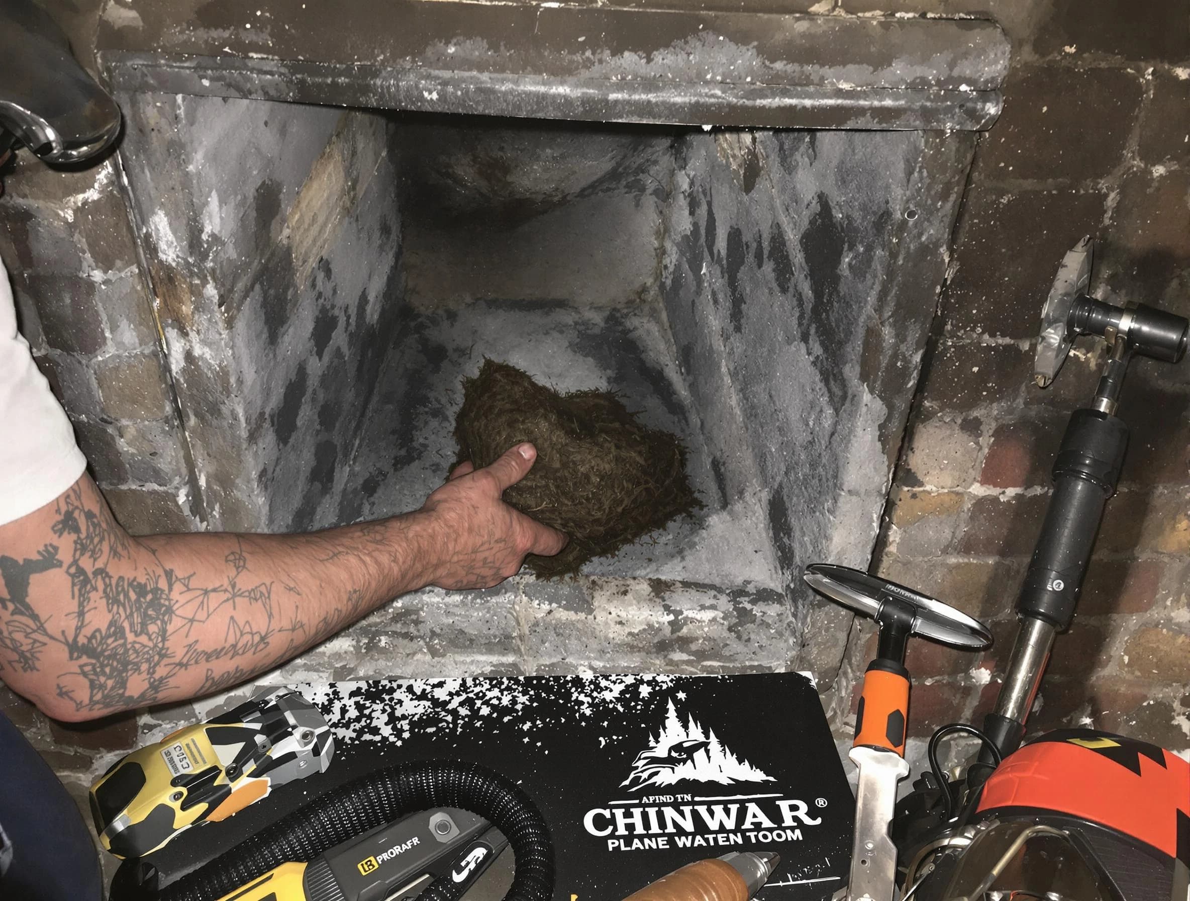 Highland Lakes Chimney Sweep safely removing debris and screening chimney in Highland Lakes, AL
